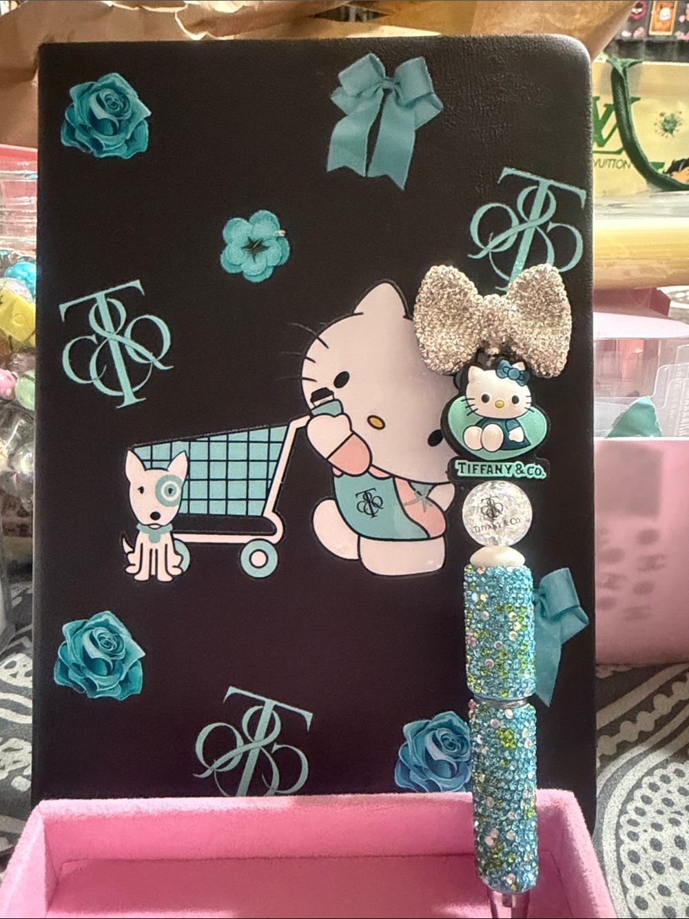 Black and teal journal with matching rhinestone pen.